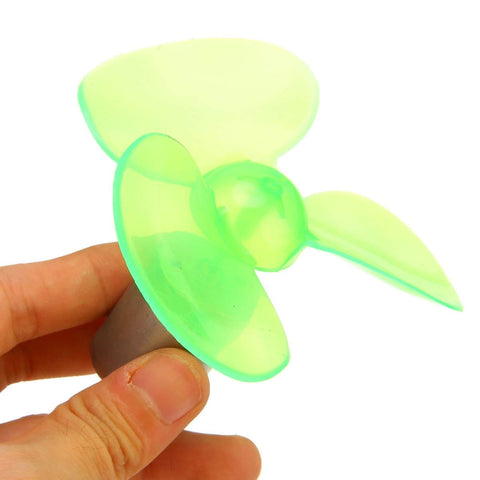 Small green propeller component of Portable Mini Wind Generator For Emergency Power And Phone Charging With 60Hz Output 6V Voltage And 4 Stroke Engine On The Go Outdoor Power Source For Camping Hiking Or Off Grid Anywhere