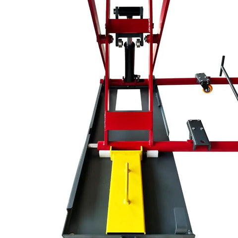Heavy Duty Eight Thousand Pound Scissor Lift With Lockable Drive Ramps And Portable Frame, top view showcasing hydraulic components and yellow ramps.