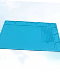 Top Notch Silicone Repair Mat With Heat Resistant Non Slip Surface And Precision Pin Layout For Soldering Stations Laminating Machines And No Sweat Tech Fixes, blue color, flat layout.
