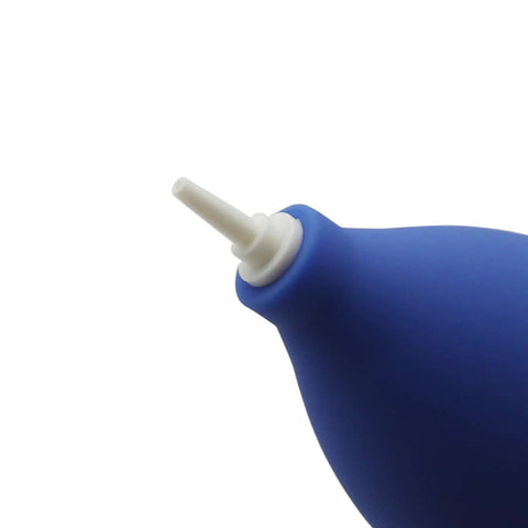 Blue rubber air duster blower with white nozzle for electronics cleaning, powerful odorless air blaster for watch and gadget dust removal.