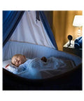 1080P Indoor Camera With Night Vision And 2 Way Audio Rolling 2 Day History Free For Two Years Motion Alerts For Pet Or Baby Monitoring Easy Setup And Works With Alexa And Google Home beside a sleeping baby in crib