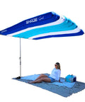 Wind Inflating Beach Shade With Silent Non Flapping Design Auto Directing Canopy over a woman on the beach