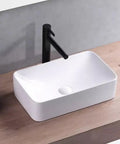 USZWBY Vessel Sinks Modern Minimalist Table Basin On The Counter Rectangular Washbasin Ceramic Art Bathroom Bowl Sink on wooden countertop with black faucet.