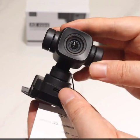 Rock Solid 4K AI Gimbal Camera For Rc Fpv Drones Packed With 6X Digital Zoom And Smart Motion Tracking held in hand.