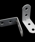 Heavy Duty White Corner Brace L Brackets For Furniture Repair Pack Of Twenty With Reinforced Steel Core To Keep Wooden Pieces Rock Solid And Tighten Loose Joints Without Any Sweat, showing two L brackets.