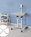 Top Shelf Height Adjustable Standing Laptop Desk With Smooth Roll Wheels Ergonomic Sit Stand Work Cart For Your Chill Home Office Bedroom Or Living Room Natural Wood Portable Mobile Desk beside a white shelf