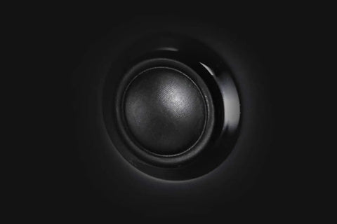 Close-up of speaker driver from GigaWorks T40 Series II 2.0 Desktop Speaker System with BasXPort Tech delivers full bass without a sub.