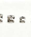 Four metal cam locks from the All In One 120 Piece Furniture Cam Lock And Hardware Assortment Kit, shown on a white background.