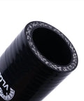 Close-up of black 4-Ply 90 Degree High-Performance Silicone Hose Coupler, 1 to 1.25 Inch ID, showing outer texture and reinforcement.