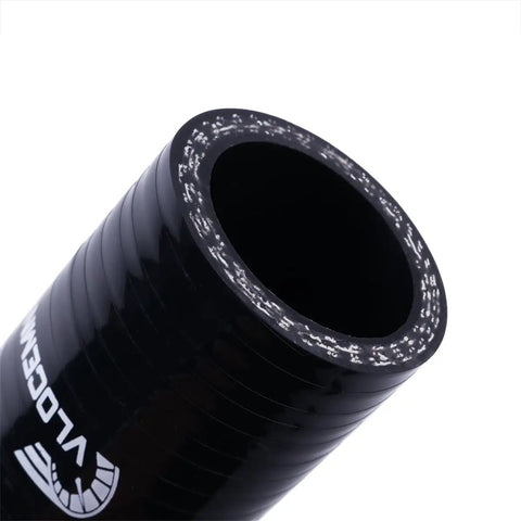 Close-up of black 4-Ply 90 Degree High-Performance Silicone Hose Coupler, 1 to 1.25 Inch ID, showing outer texture and reinforcement.