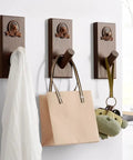 Slick Wall Mounted Coat Rack With Nifty Key Organizer Hook For Bathroom Entryway Closet Top Tier Heavy Duty Multi Hook Stand No Hassle Setup For Versatile Hats Purses And Keys with three hooks holding bags and a scarf.