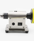 Side view of Jewelry Polishing Machine Multifunction Bench Buffer Grinder This All In One Workhorse Tool Delivers Smooth Clean Finishes With 4500 To 9000 RPM Variable Speed For Delicate Jewelry Polishing And Metal Finishing At Home Or Studio, featuring silver body and large buffing wheel.
