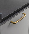 Six Pack 5 Inch Champagne Bronze Knurled Cabinet Pulls With Crosshatch Knurling for kitchen cabinets, showing a close-up installed view.