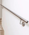 Heavy Duty Stainless Steel Handrail Kit For Indoor And Outdoor Decks Stairs And Balconies With No Sweat Wall Mount Setup and Pro Grade Two Inch Tubing Safety Guard Rail System on a stairway.