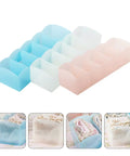 Keep Your Dresser Slick With This Heavy Duty Stackable Underwear Organizer Box Featuring Five Secure Grid Dividers For Neat Sock And Undergarment Storage Drawer in various pastel colors.
