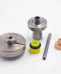 Seal kit for waterjet cutting machine; metal discs, cylindrical fittings, yellow rubber seal, copper fitting, and steel rod.