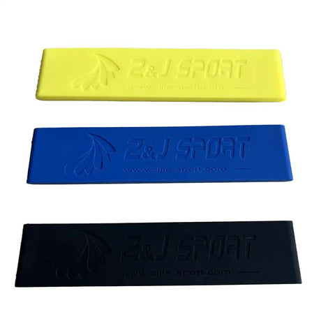 Three silicone paddle blade tip protectors in yellow, blue, and black for Dragon Boat paddles, size 38mm by 177mm