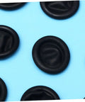 Boss Level Black Antistatic Finger Covers Straight Up Sweat Resistant Cotton Workshop Sleeve Guards close-up on blue background