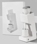 Top Shelf Single Dose Coffee Grinder Featuring 38mm Steel Cone Burrs And Minimal Ground Retention For Hella Precise Espresso Pour Over French Press Brewing Setup in sleek white design.