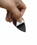 Hand holding 52 Piece Finger Oscillating Multi Tool Sanding Pads Kit With Two Finger Pads And Fifty Sandpaper Sheets Aluminum Oxide