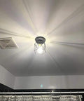 Retro Black Industrial Cage Ceiling Light 2 Pack, Compact Semi Flush Mount Pendant Fixture With E27 Base For Hallways Stairways Bedrooms And Kitchens solid build illuminating a bathroom.