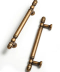 Vintage Antique Brass Cabinet Pulls Set Of Five With Three And Three Quarters Inch Hole Centers, shown in angled view.