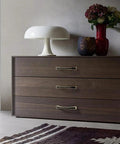 Dark wooden dresser with 2 Pack 5.0 Inch Hole Center Zinc Alloy Square Cabinet Handles In Black Gold Finish installed.