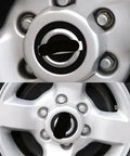 Close-up of a Four Pack Silver Wheel Hub Center Caps For Nissan Frontier And Xterra 2000-2004 16 Inch Wheels Fits 40315-7Z100