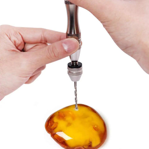 Person using Rock Solid Aluminum Hand Pin Vise Kit Hella Tough with micro twist drill on resin for detailing work.
