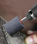 Ten Pieces 25mm Cylindrical Aluminum Oxide Mounted Grinding Stones Rotary Grinding Bits With One Quarter Inch Shank For Electric Rotary Tools Drill Grinders Pro Grade Shop Ready close-up on dark surface