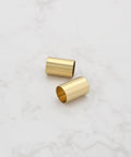 Two brass pot sleeves for guitar split-shaft pots, 6.35mm OD x 6.04mm ID.