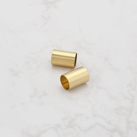 Two brass pot sleeves for guitar split-shaft pots, 6.35mm OD x 6.04mm ID.