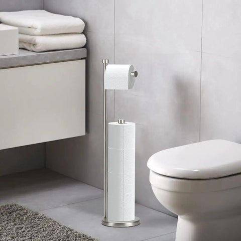 Brushed Nickel Freestanding Toilet Paper Holder Stand With Storage For Mega Rolls beside toilet in modern bathroom