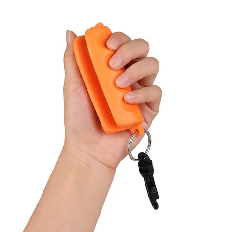 Hand holding Orange Archery Arrow Puller Gripper With Belt Clip Two Pack Grab And Go Soft Molded Handle Anti Skid Grip Keychain