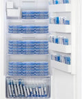 Top Tier 33 Inch Upright Freezer With Built In Icemaker And True No Frost Operation, Holds A Ton At 21 Cubic Feet open showing ice packs and adjustable shelves.
