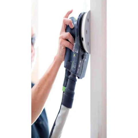 5-Inch Random Orbital Sander ETS EC 125/3 EQ-Plus in use on vertical surface, ergonomic grip detail visible