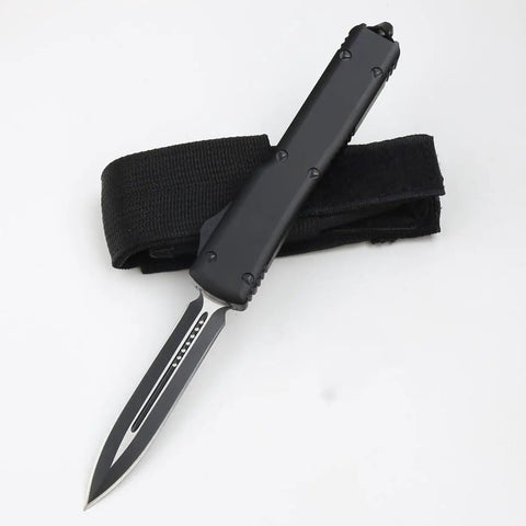 Compact Pocket Hunting Knife With Glass Breaker For Camping And Survival Ready Gear, black handle with clip displayed.