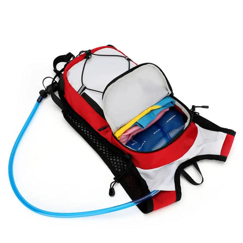 All Terrain Hydration Backpack With 2L Water Bladder Lightweight Outdoor Pack Built For Trail Running, Hiking, Mountaineering, Cycling And Sports Waterproof Hydropack In Green, showing open compartment with clothes and hydration tube.