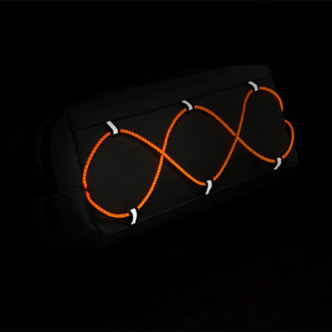 Front Bike Bag Waterproof Big Capacity Handlebar Storage Bag For Gear Tools Snacks featuring orange bungee cords in dark setting