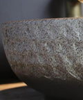 Close-up of USZWBY Vessel Sinks Wash Basin Ceramic Art Table Retro Wash Basin, showcasing the textured surface and round shape.