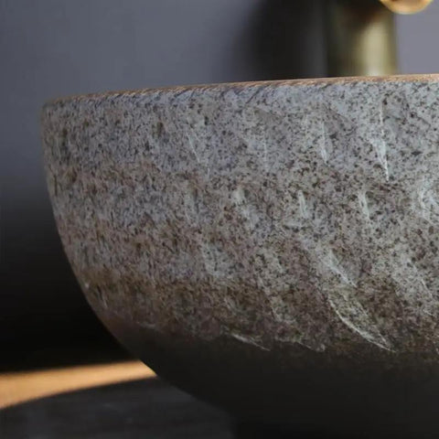 Close-up of USZWBY Vessel Sinks Wash Basin Ceramic Art Table Retro Wash Basin, showcasing the textured surface and round shape.