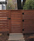 Wooden gate with Sturdy Six Inch Farm Flip Fence Gate Latch And Barn Door Lock Flip Latch Hardware In Matte Black installed.