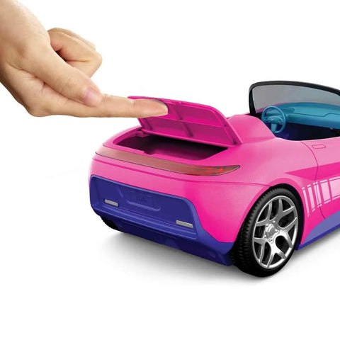 Fingers opening hidden trunk of Remote Control Pink Convertible RC Toy Car With Dual Driving Modes For Storytelling Or Fast Action.