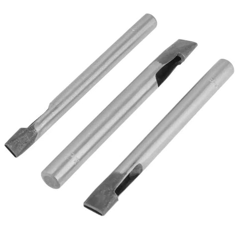 Three metal pieces from the 2Mm Leather Oval Hole Punch Kit, 9 Piece Carbon Steel Hollow Punch Set for Leatherwork and Crafts.