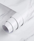 Close-up of Wide Milk White Marble Wallpaper Easy Peel And Stick 24 Inch By 394 Inch Roll showing glossy and thick texture