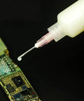 Solder Paste Booster Kit For Mobile Phone PCB BGA Reballing And Pro Grade Soldering Flux Set With Push Rod And Syringe Needle Booster Tool Halogen Free Aluminum Red in use on PCB with syringe.