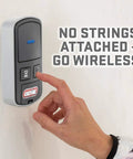 Person operating Intellicode Wireless Wall Console for Garage Door Openers Made After 2013 in a black finish with blue LED
