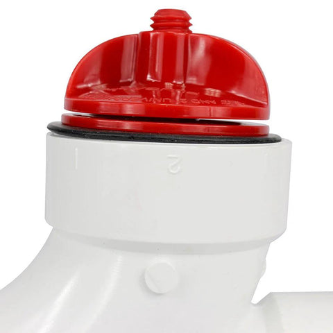 Front view of DANCO PlugAll mechanical test plug with red cap on white PVC fitting for 1-1/2–2 in DWV pipes