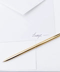 Premium Ballpoint Pen Set Of 6 In Glossy White Gift Box With Gold And Black Ink For Women And Men, sleek gold pen on white paper