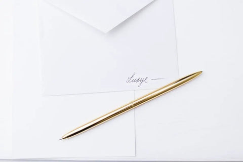 Premium Ballpoint Pen Set Of 6 In Glossy White Gift Box With Gold And Black Ink For Women And Men, sleek gold pen on white paper